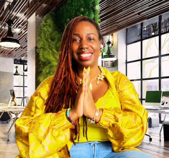 Tasha, founder of Om Goddess Yoga, smiling with her hands together